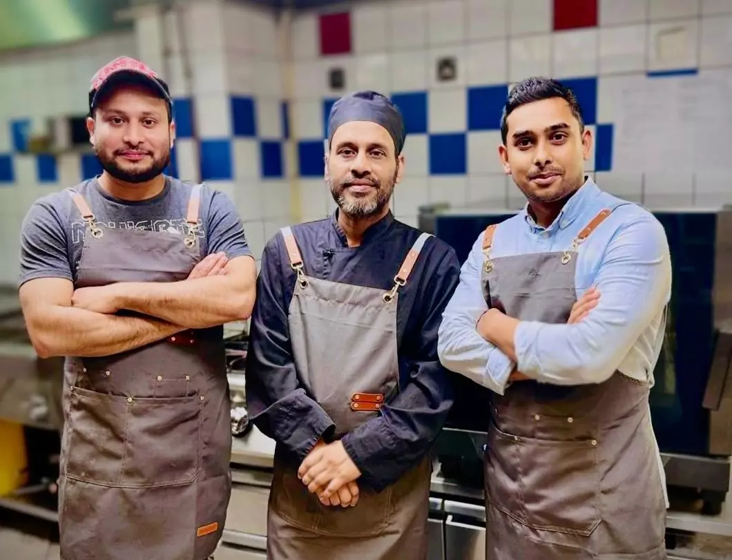 three chef in kitchen